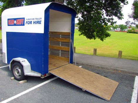 Easy access ramp and side rails for secure loads